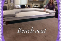 Custom curved bench seat cushion with upholsterer posing in workshop