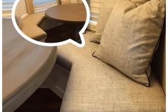 Linen banquette seat cushion with accent pillows in breakfast nook