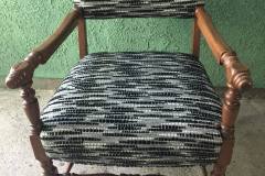 Black and white abstract-weave armchair with turned legs