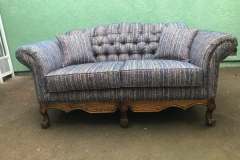 Multicolor striped tufted camelback loveseat with carved claw feet