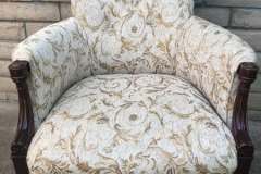 Gold scroll-pattern accent chair with turned mahogany legs