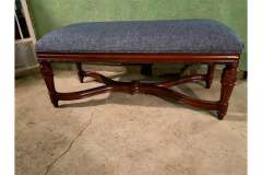 Blue upholstered bench with carved mahogany stretcher base