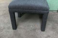 Charcoal textured fully-upholstered Parsons ottoman
