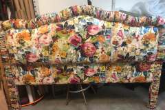 Colorful floral upholstered headboard in workshop