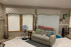 Geometric diamond-pattern valances over living room windows