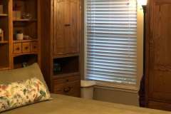 Floral bird-print valance in client bedroom over window