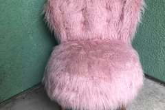 Pink faux-fur tufted accent chair with tapered wood legs