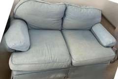 Blue loveseat marked 'Before' — awaiting reupholstery