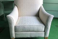 Cream geometric-pattern armchair with gold-tipped feet